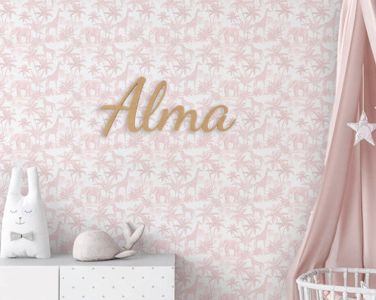 Decorative wall with floral pattern, 'Alma' nameplate, and baby items against a pink background