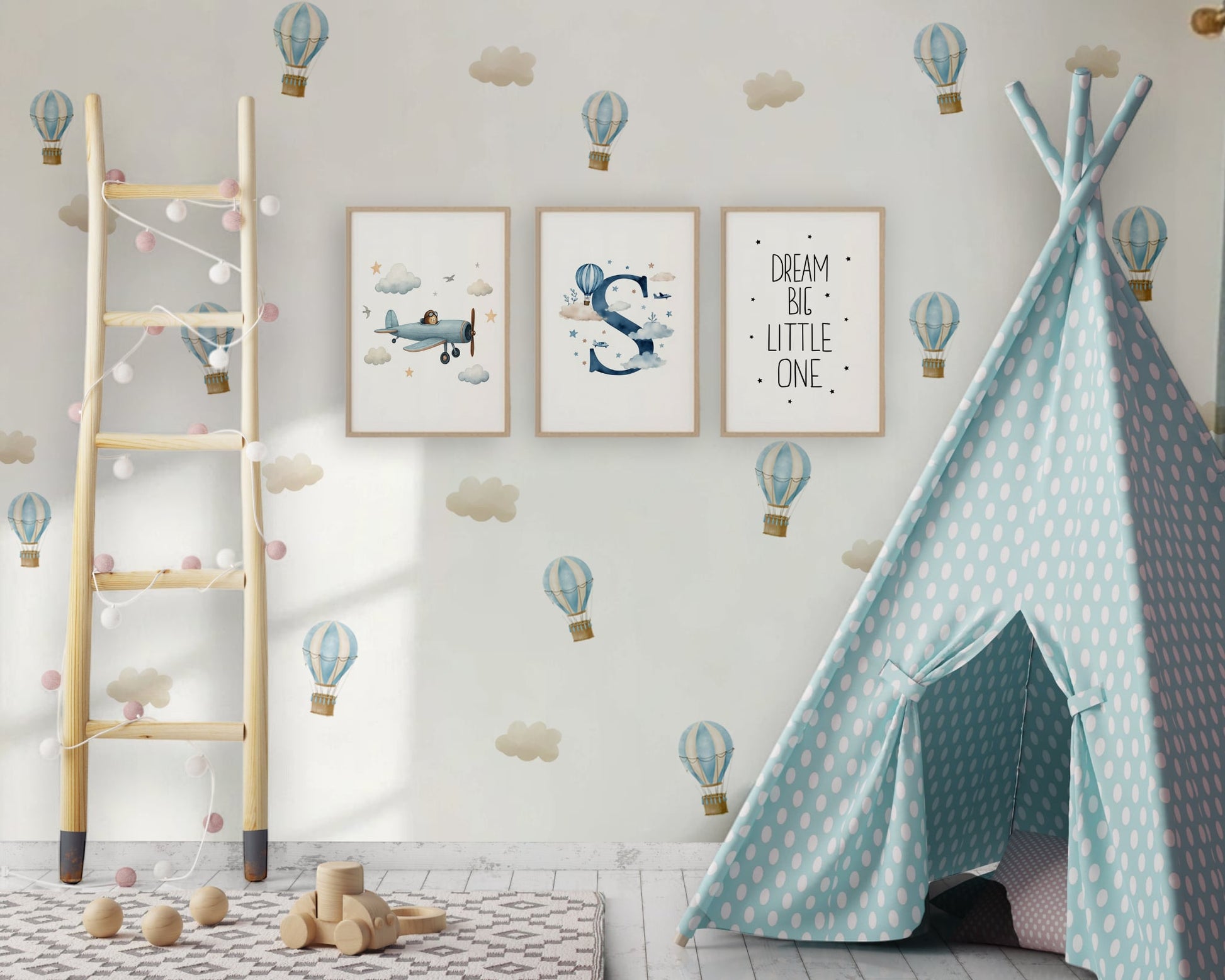 Children's room with a teal polka dot teepee, wooden ladder, and wall decorations.