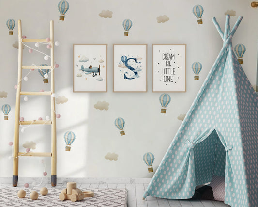 Children's room with a teal polka dot teepee, wooden ladder, and wall decorations.