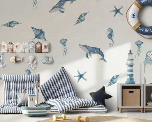 Children's room with nautical theme decor, including wall stickers of dolphins and seahorses.