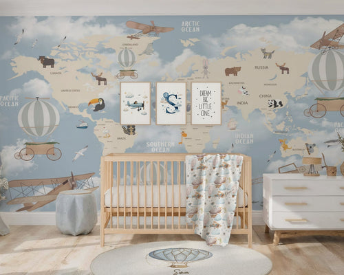 Nursery room with world map wall mural, crib, and dresser.
