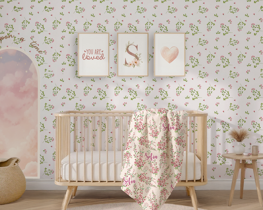 Nursery room with floral wallpaper, crib, and decorative elements.