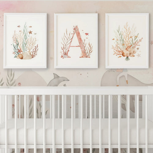 Nursery room with a crib and wall art featuring coral and letter 'A'.