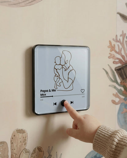 Child pressing a button on a sound-enabled magnet part of the Set 3 Tiny Koala bundle.