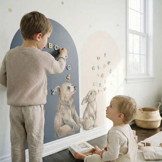 Montessori magnetic story wall with bear and bunny arch wall decals stickers, soft atmosphere dot stickers, and toddlers playing with alphabet magnets in a Scandinavian nursery